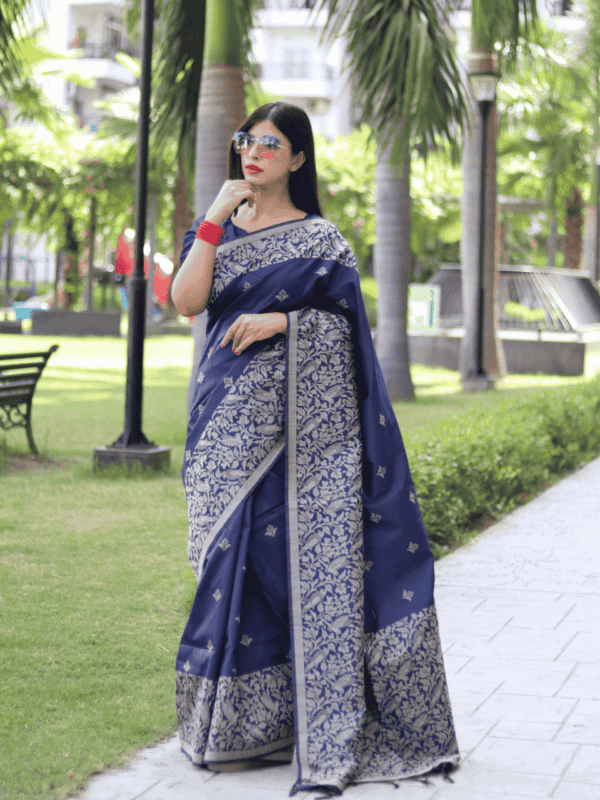 A stunning Banglori Handloom Raw Silk Saree with delicate weaving buttis, a rich woven pallu, and a running blouse piece, offering a blend of tradition and sophistication.