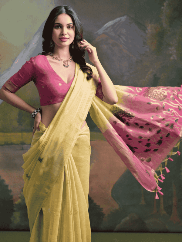 Luxurious soft silk saree with a vibrant resham pallu, peacock weaving, traditional zari border, resham butties, and a stylish contrast blouse piece.