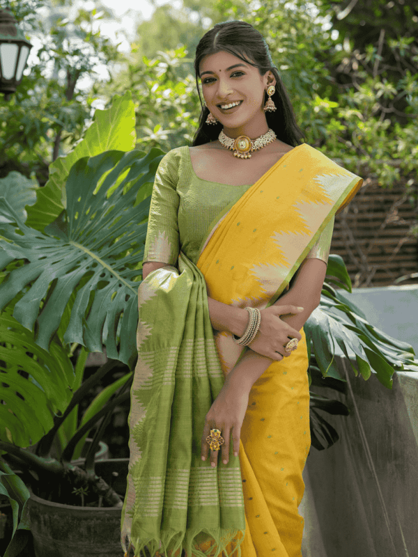 Semi Tussar Silk Saree with Bandhani butti weaves, temple border, zari-lined pallu, and matching blouse for a classic look.