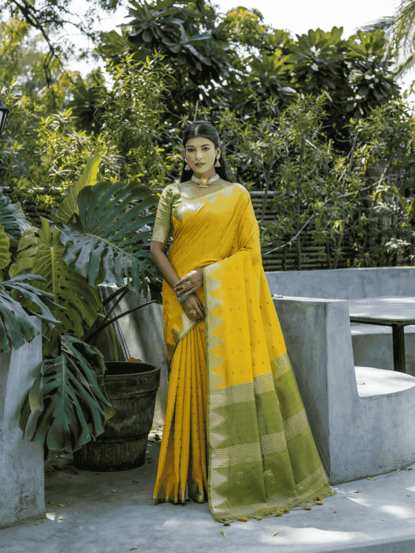 Semi Tussar Silk Saree with Bandhani butti weaves, temple border, zari-lined pallu, and matching blouse for a classic look.