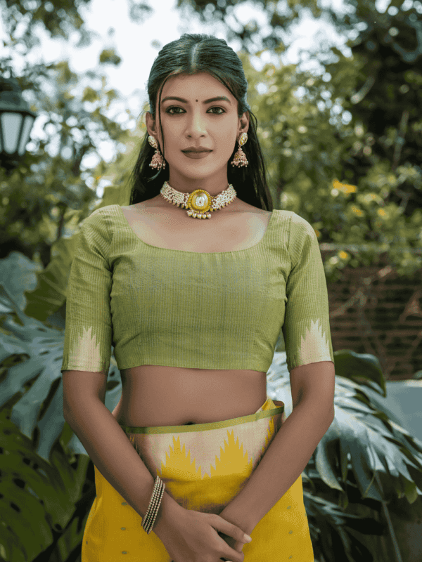 Semi Tussar Silk Saree with Bandhani butti weaves, temple border, zari-lined pallu, and matching blouse for a classic look.