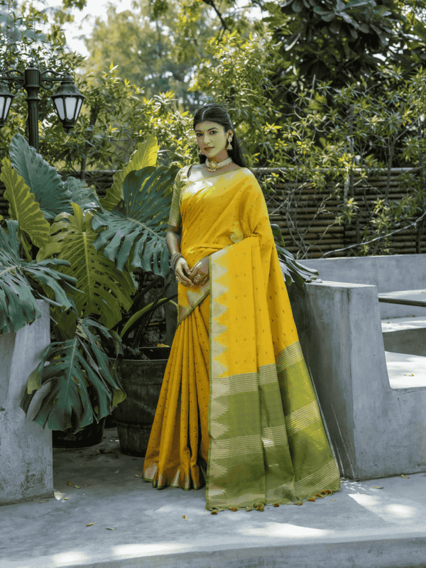 Semi Tussar Silk Saree with Bandhani butti weaves, temple border, zari-lined pallu, and matching blouse for a classic look.