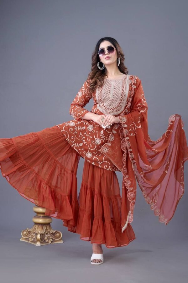 Heavy georgette sharara set with embroidery, ruffle flair, full-sleeve top, and embroidered dupatta.